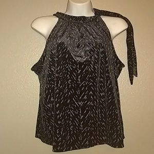 Blouse has a tie around the neck